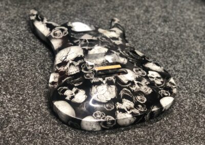 Guitar body and neck hydro dipped in white skulls and roses