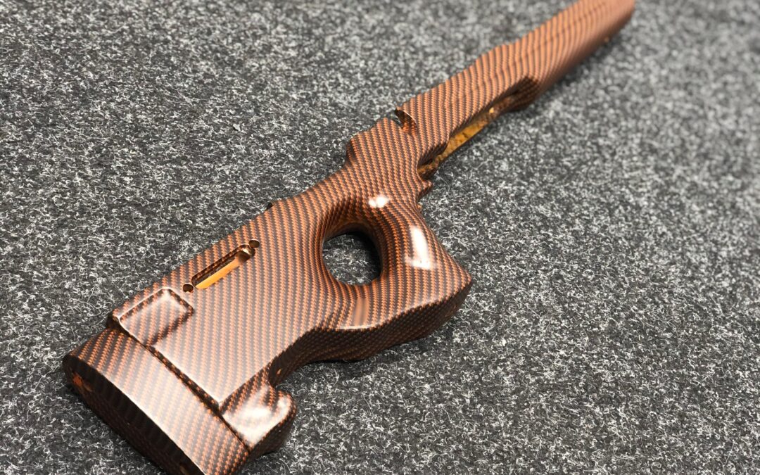 Gun rifle stock hydro dipped in orange carbon fibre
