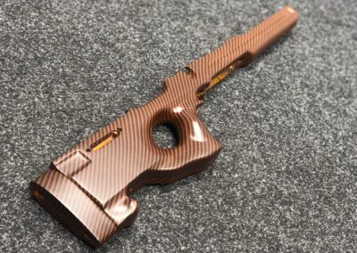 Gun rifle stock hydro dipped in orange carbon fibre