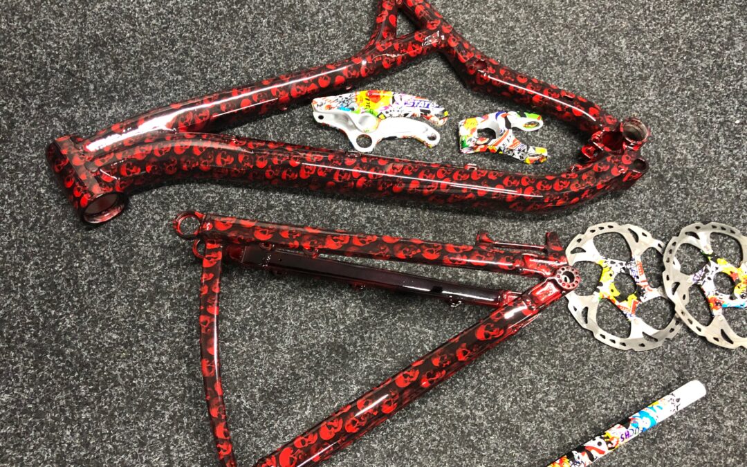 MTB frame and forks hydro dipped in red skulls and sticker bomb