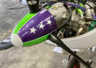 Cessna nose cone custom painted in purple, green and white with stars