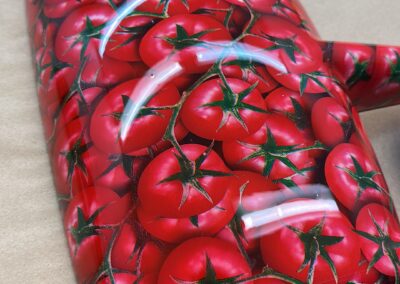 Close-up of a glossy tomato pattern wing mirror cover