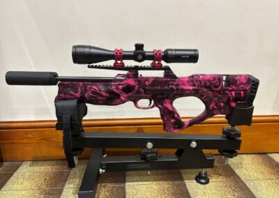 Air Rifle Stock Hydro Dipped in Pink Venom, on a rifle rest