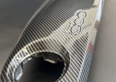 Carbon fibre around the round opening on a Fiat 500 dash trim