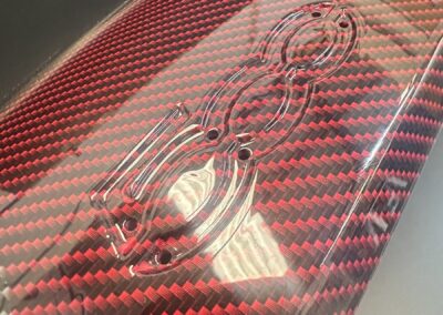 Close-up of the 500 logo on a red carbon dash trim