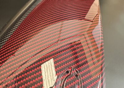 Red carbon fibre weave around the Fiat 500 logo