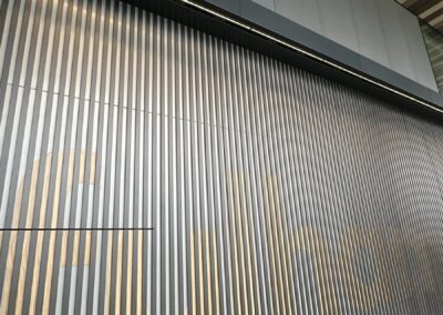 Angled view of the Fulham lettering in wood grain slats