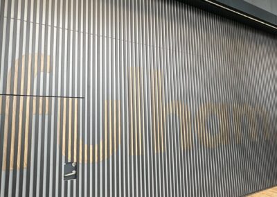 Close view of wood grain Fulham lettering at Fulham Pier