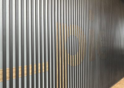 Close view of wood grain Pier lettering at Fulham Pier