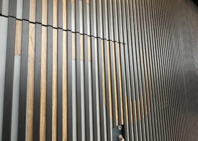 Wood grain and dark grey slats at a close angle, Fulham Pier