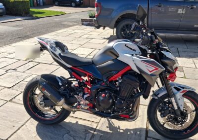 Kawasaki Z900 Hugger Hydro Dipped in Lined Carbon and Seat Cowl in Lest We Forget, front three-quarter view