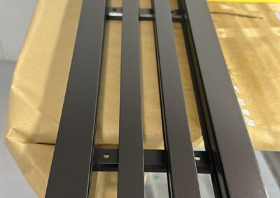 Linear air vent grille with a dark brass painted finish