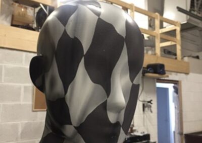Mannequin Light Stand Custom Painted in a Chequered Flag Design, checks in progress head and shoulders