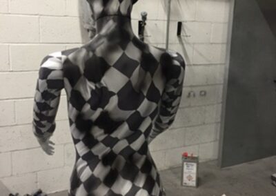 Mannequin Light Stand Custom Painted in a Chequered Flag Design, checks in progress rear view