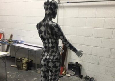 Mannequin Light Stand Custom Painted in a Chequered Flag Design, checks in progress side view