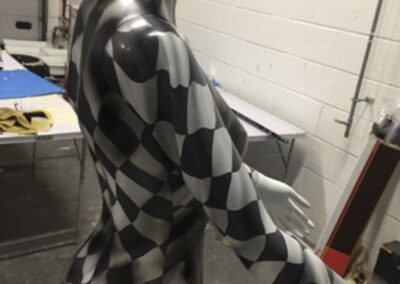 Mannequin Light Stand Custom Painted in a Chequered Flag Design, checks in progress torso detail