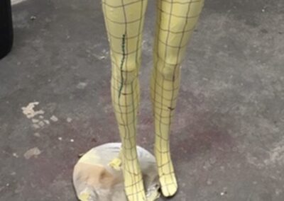 Mannequin Light Stand Custom Painted in a Chequered Flag Design, legs primed yellow with the grid marked out