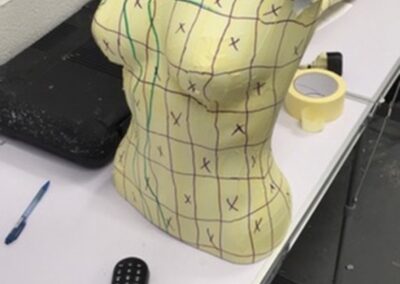 Mannequin Light Stand Custom Painted in a Chequered Flag Design, torso primed yellow with the grid marked out