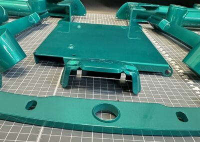 Metallic teal mobility base plate and frame parts
