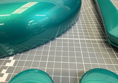 Close-up of a metallic teal mobility guard and caps