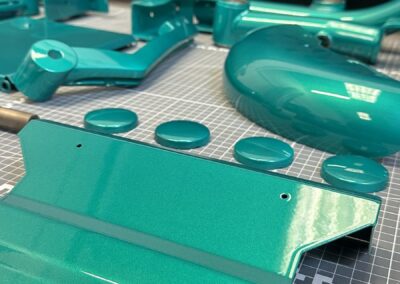 Metallic teal painted mobility panel and trim caps