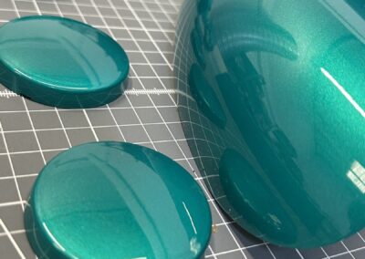 Detail of metallic teal painted trim caps