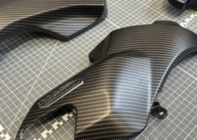 Motorcycle panel hydro dipped in matte black carbon fibre