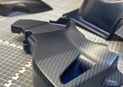 Motorcycle panel hydro dipped in matte blue carbon fibre