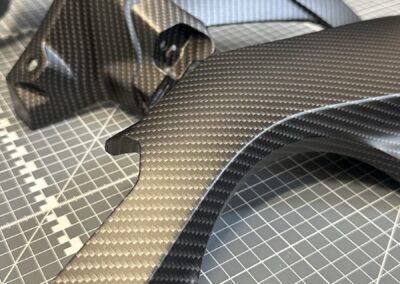 Motorcycle side panel hydro dipped in matte black carbon fibre