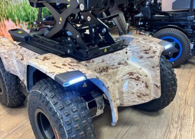 Front light and desert camo panels on an off-road powerchair