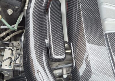 Carbon fibre hydro dipped Porsche intake pipe detail