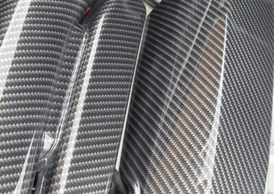 Close-up of a carbon fibre hydro dipped Porsche pipe