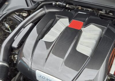 Porsche engine cover in carbon fibre, angled view