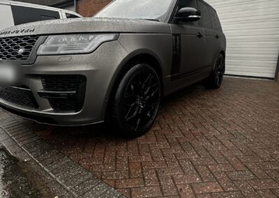 Range Rover Satin Wrap with Gloss Black Painted Exterior and Carbon Interior, front three-quarter low angle