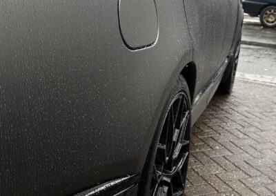 Range Rover Satin Wrap with Gloss Black Painted Exterior and Carbon Interior, rear quarter in satin wrap